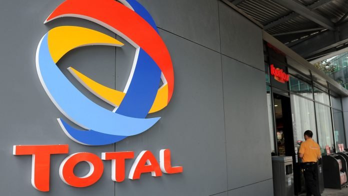 Total Gas Station And Company Headquarters...A Total SA logo is